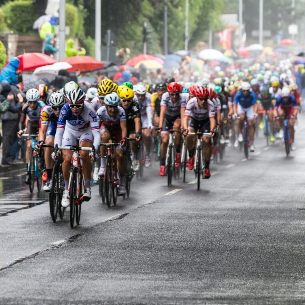 people riding bicycle on road during daytime